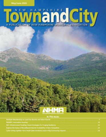 Town and City May/June 2026 cover featuring a green field with Mountains in the background