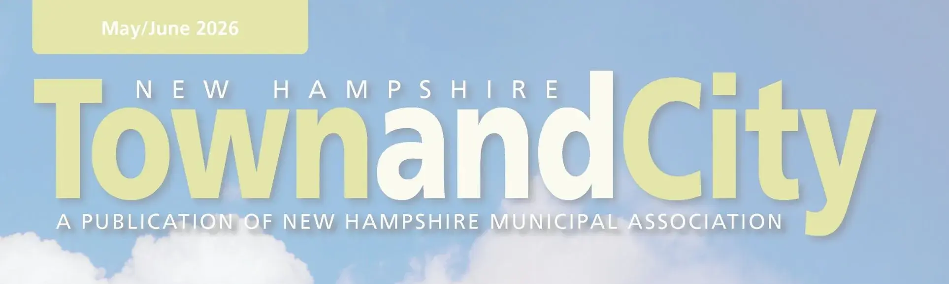 Town and City Logo in white and bright green, blue sky in the background