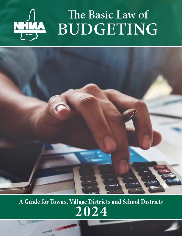 picture of a hand hovering over a calculator with Basic Law of Budgeting in white on a green background